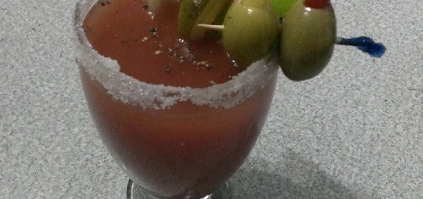 Bloody Mary (2 oz. Vodka, dash horseradish, dash Worcestershire sauce, top with homemade spicy tomato juice, in a glass with salted rim, cracked black pepper; garnished with celery stick, pickled beet wedge, smoked pickled garlic, sweet hot pickle slice, lime wedge, pepper stuffed olives) [That was exhausting to type]